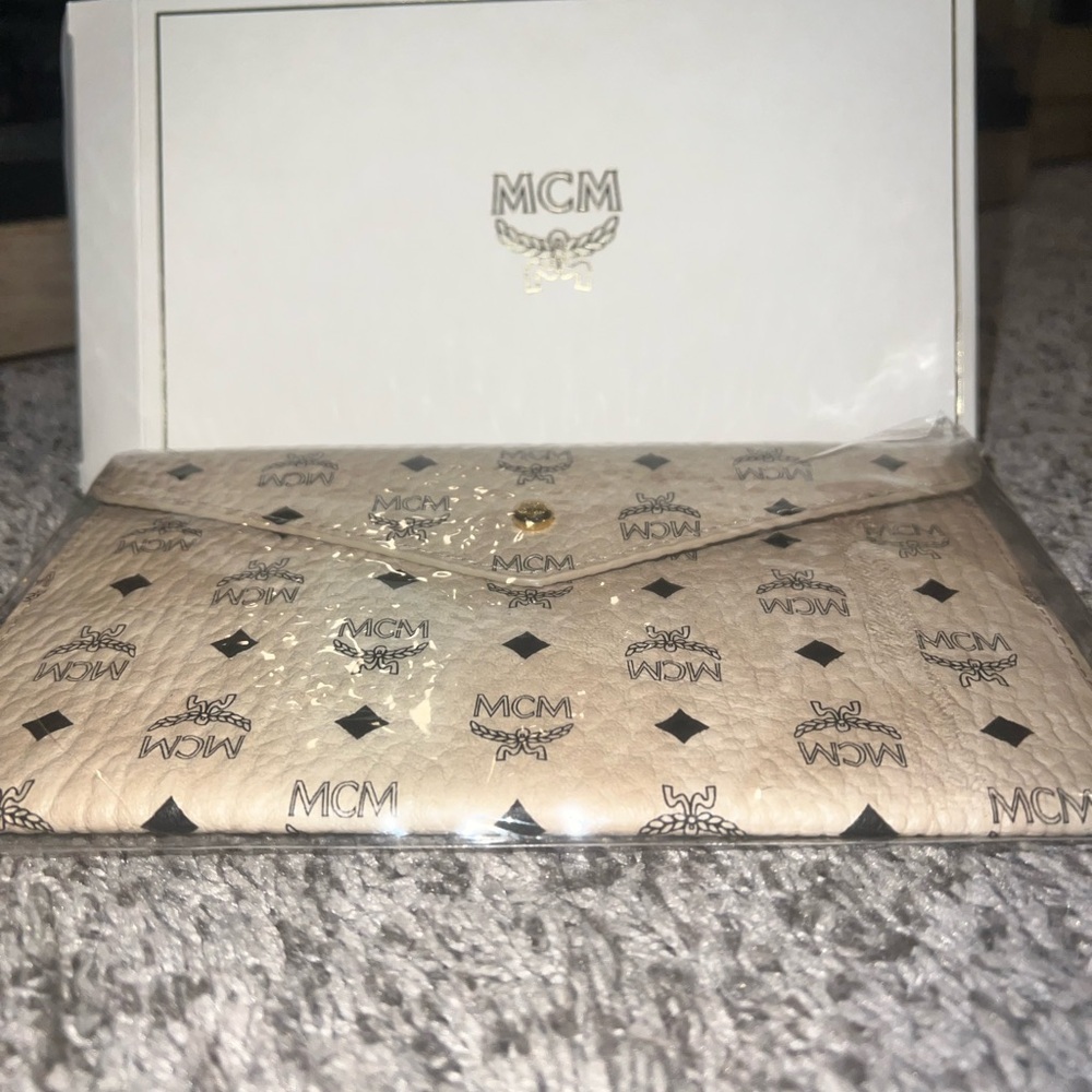 MCM Tan Clutch with Black Pattern